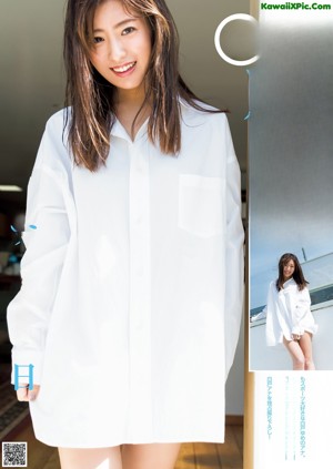 A woman in a yellow dress posing for a magazine.