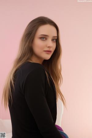 A woman in a black lingerie posing for the camera.