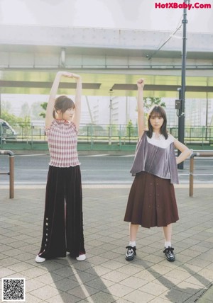 A couple of young women standing next to each other on a magazine cover.