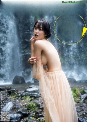 A woman in a white lingerie is putting on her panties.