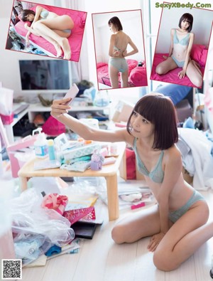 A woman in lingerie sitting on the floor in a bathroom.