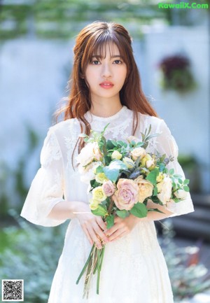 A woman with a flower crown on her head.