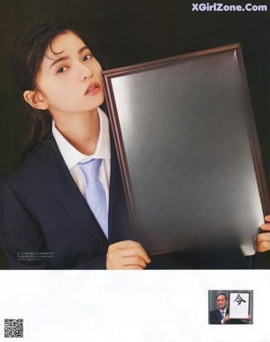 A magazine page with a picture of a girl dressed up for Halloween.