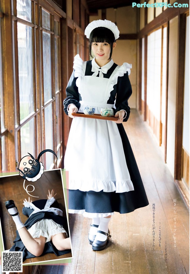 A woman in a maid outfit holding a tray of food.